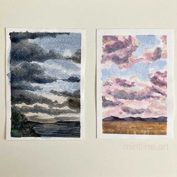 TWO WATERCOLOR SKY PAINTINGS ONE WITH DARK SKY ONE WITH LIGHT SKY