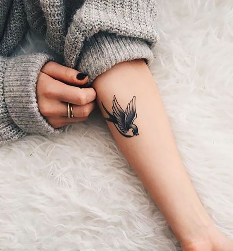 bird tattoo on arm