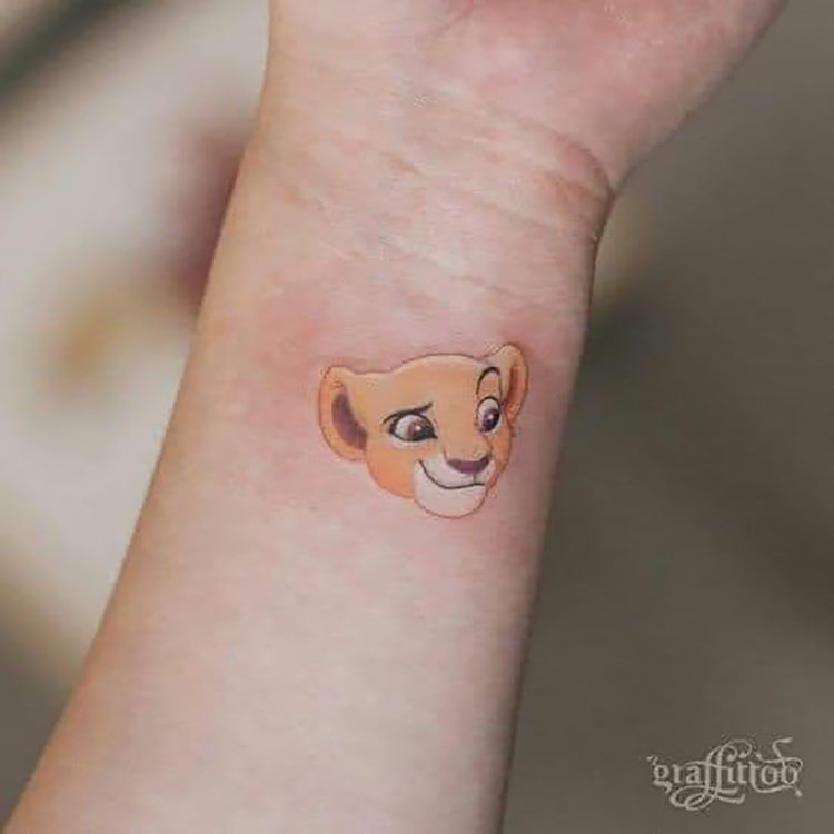 simba colored wrist tattoo