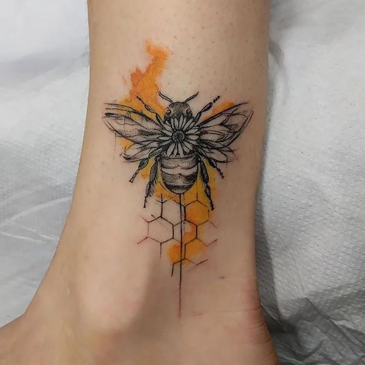 bee on ankle with honeycomb