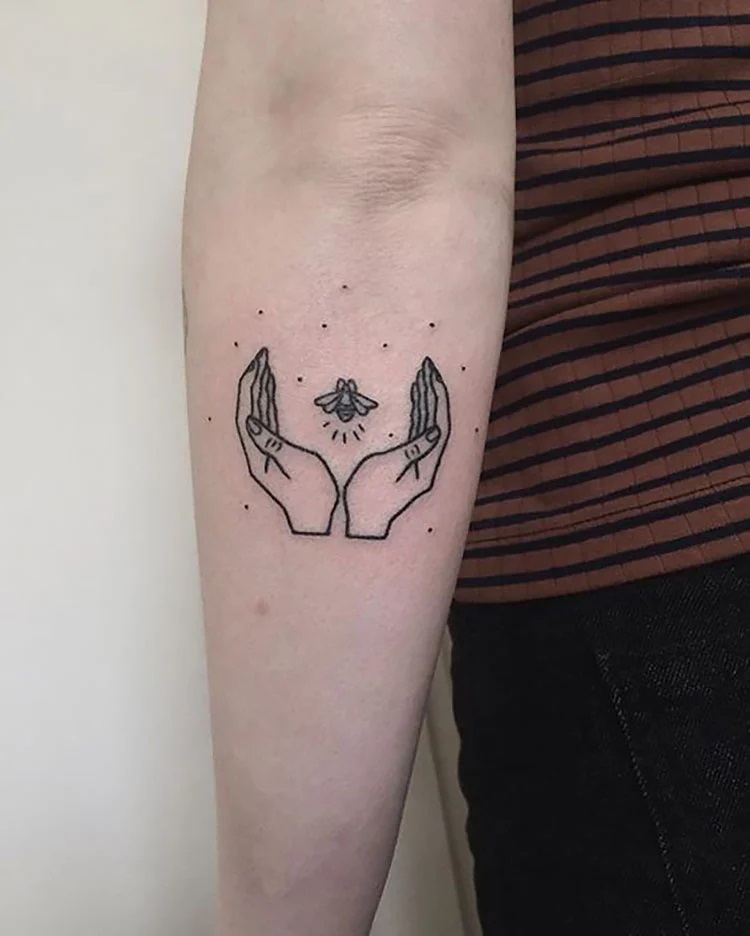 hands around bee