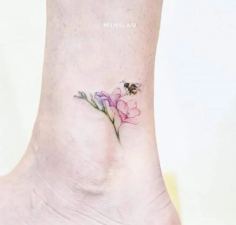 bee on flower ankle tattoo