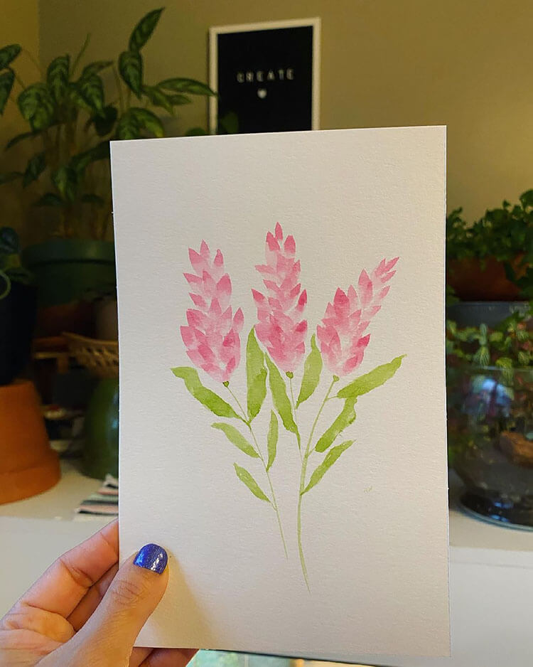 pink watercolor flowers with green leaves