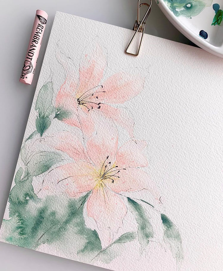 watercolor pink flower with green leaves