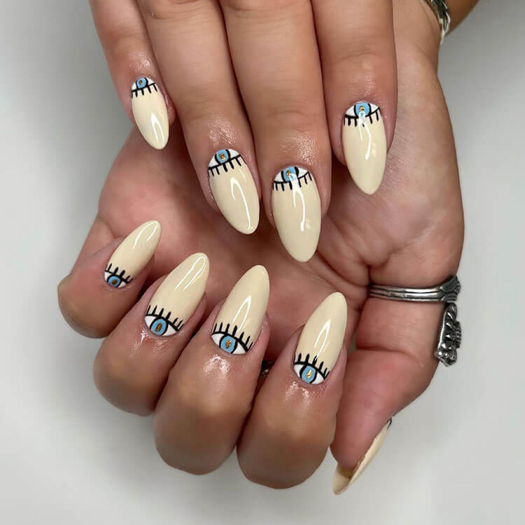 cream evil eye nails