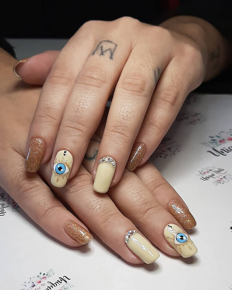 brown evil eye nails