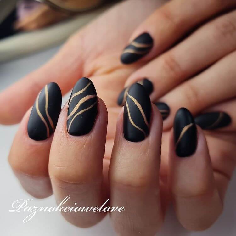 matte black nails with gold stripe