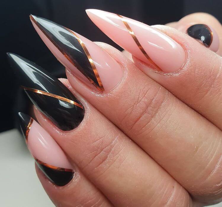 black and gold stiletto nails