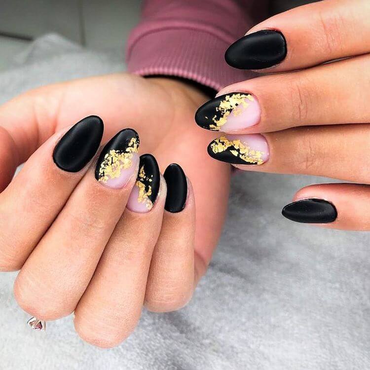 black almond nails with gold flakes