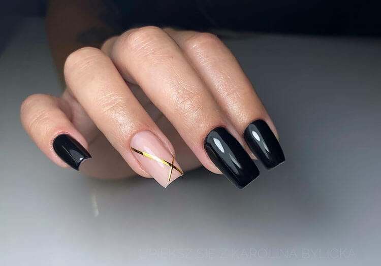 black nails with gold striping tape