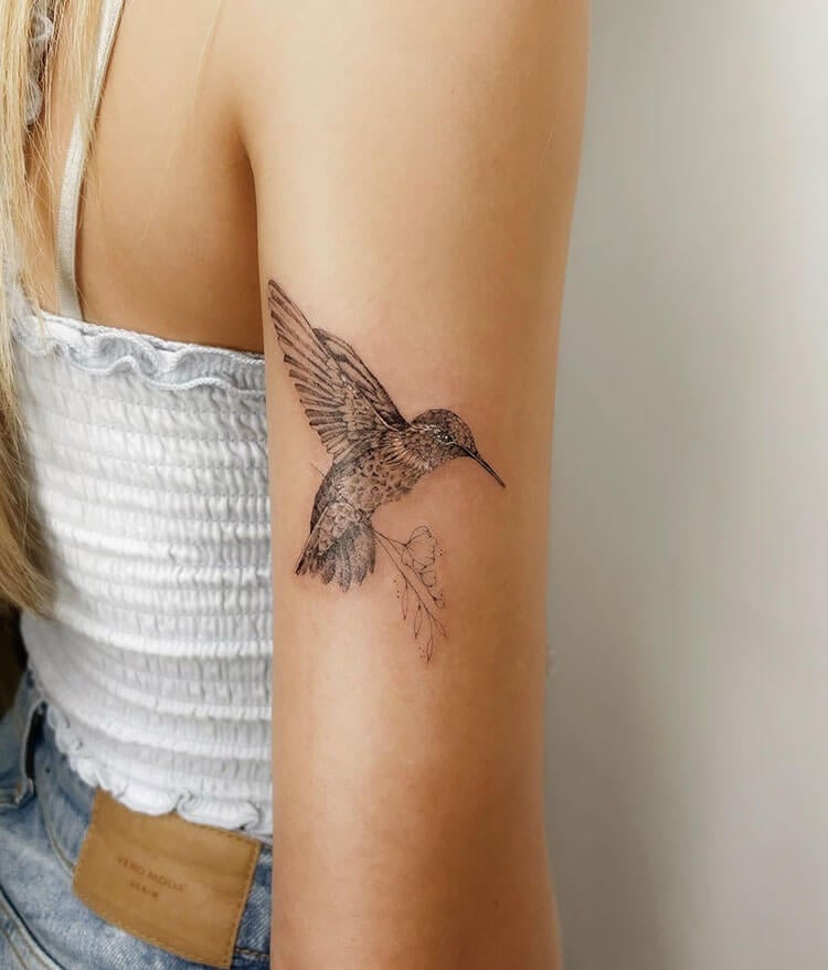 hummingbird back arm tattoo