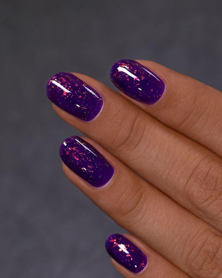 purple nails with gold flakes