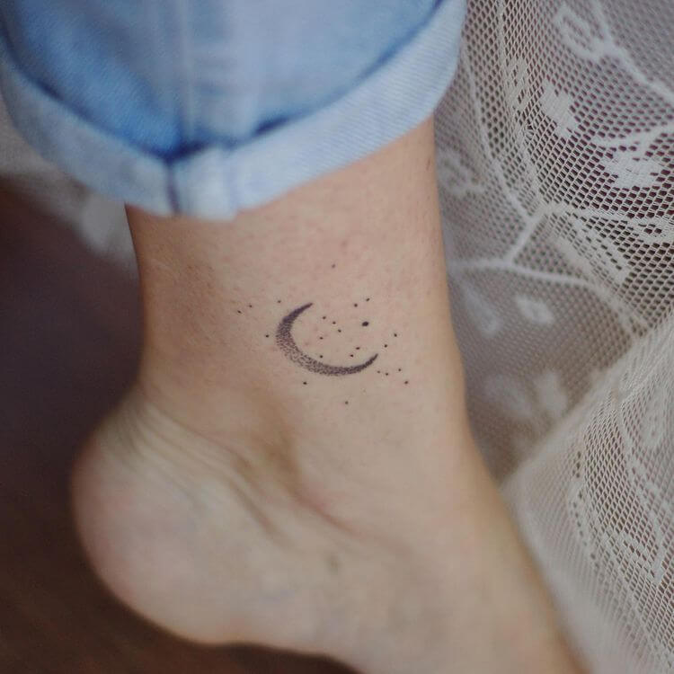 Small moon tattoo on the wrist.