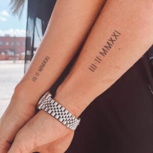 matching Roman numeral tattoos